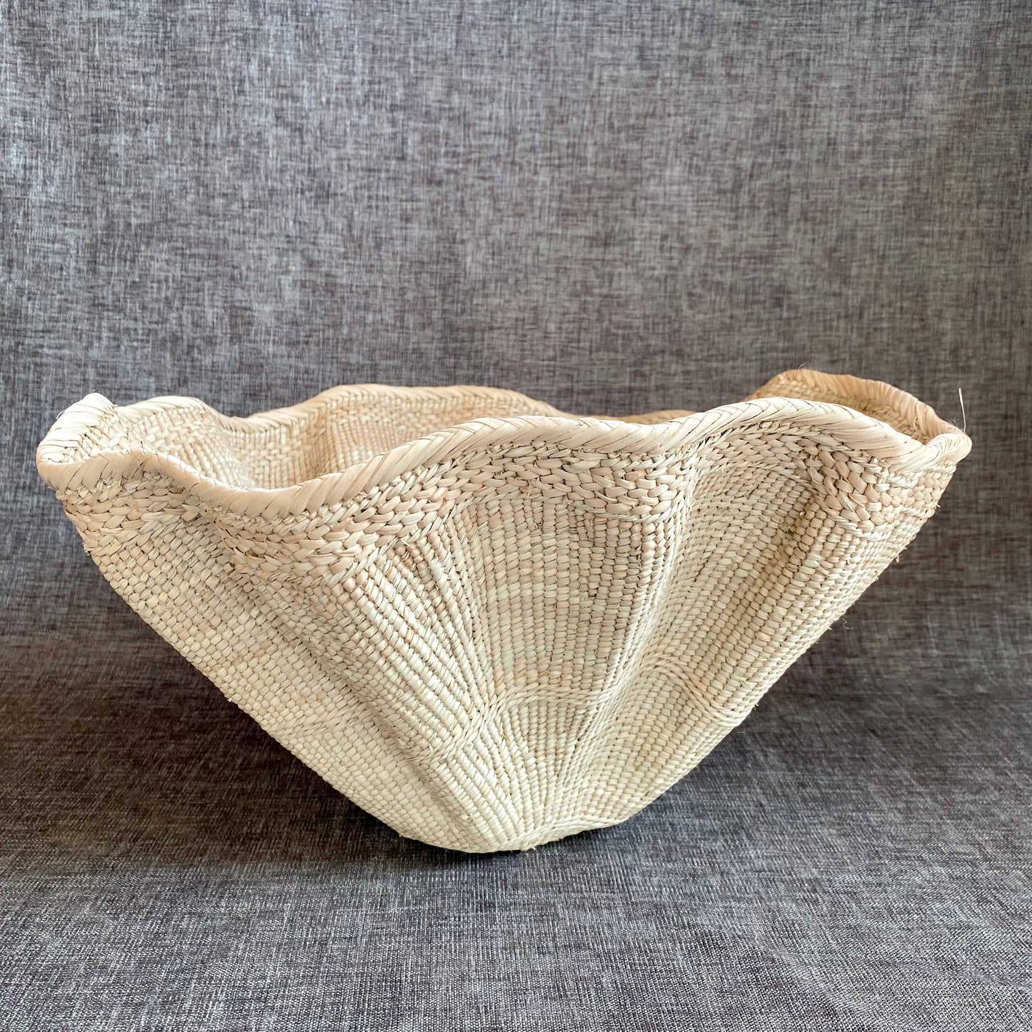 Dramatic Rippled Palm Leaf Dancing Basket